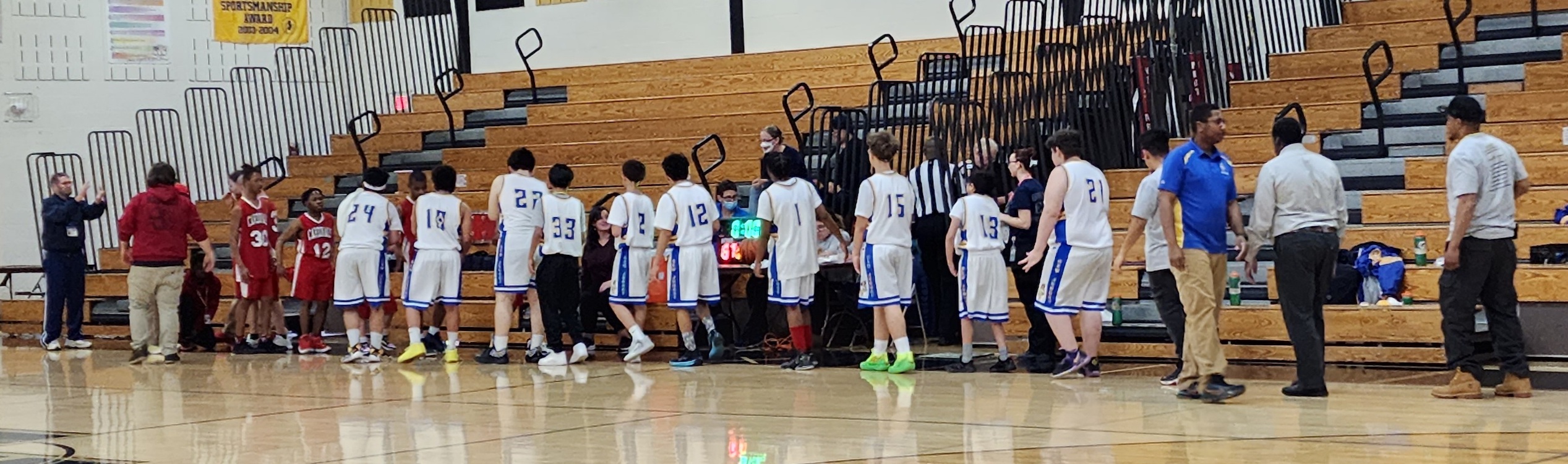 MKSD Boys basketball team lined up to congratulate opponents